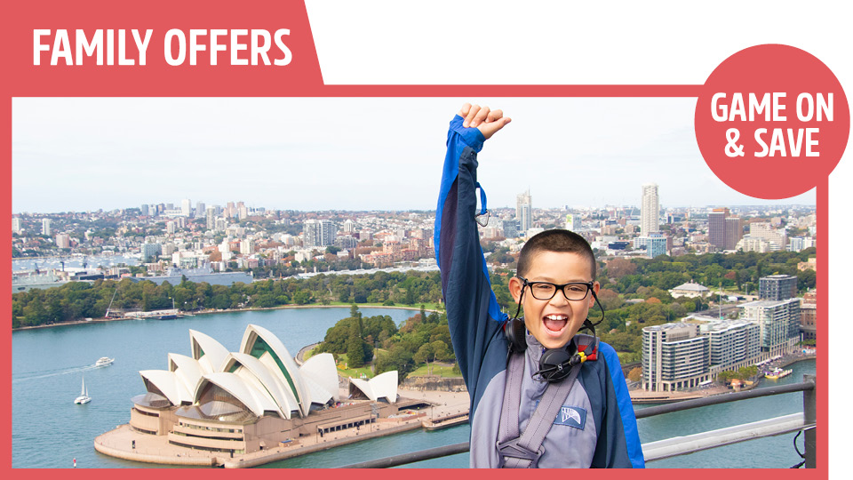 bridgeclimb family school holiday offer celebrating at the summit of the Bridge with Sydney Harbour in the background