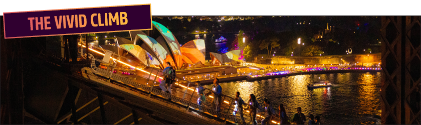 sydney harbour bridge at night lit up in neon lights during vivid sydney