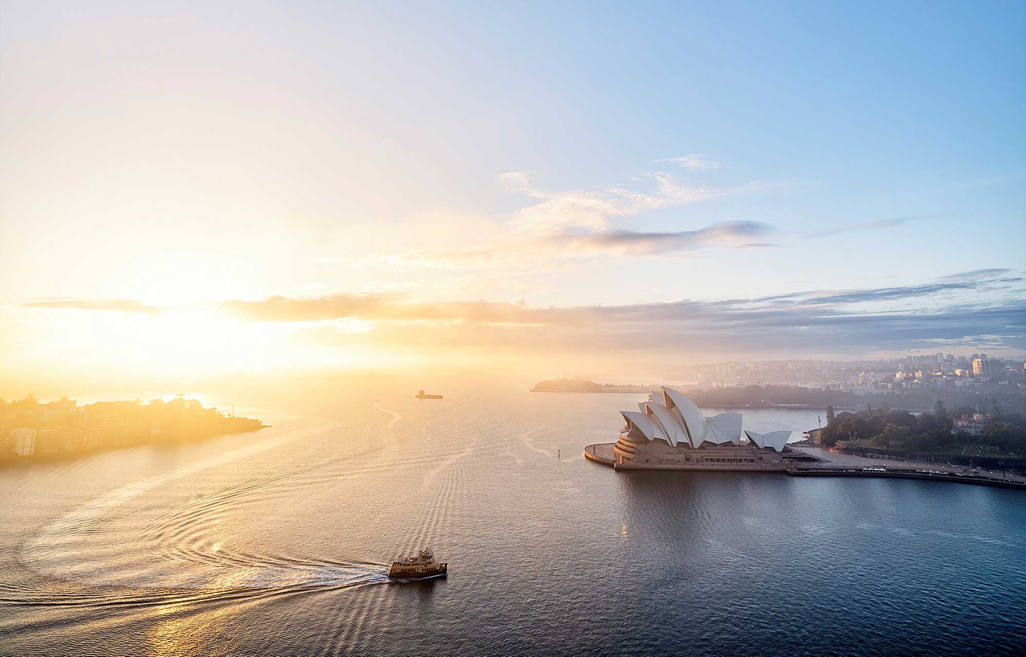 sydney opera house and the harbour at sunrise