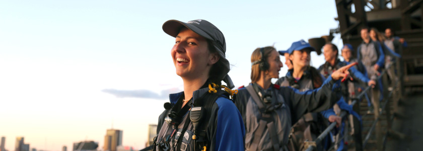 group of climbers looking out at the view with a climb leader in the foreground