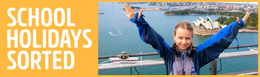 school holidays sorted with smiling girl at the top of the sydney harbour bridge with thumb up 