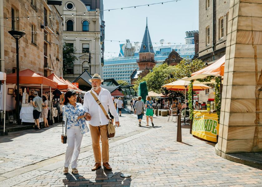 older couple walking through the rocks markets